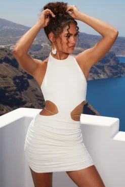 Midsummer Dreams Cut Out Waist Chain Mini Dress In Ivory -Women Clothes Shop 4389 1 midsummer dreams ivory cut open side chain detailing halter ruched mini dress 1