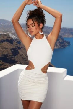 Midsummer Dreams Cut Out Waist Chain Mini Dress In Ivory -Women Clothes Shop 4389 2 midsummer dreams ivory cut open side chain detailing halter ruched mini dress 1