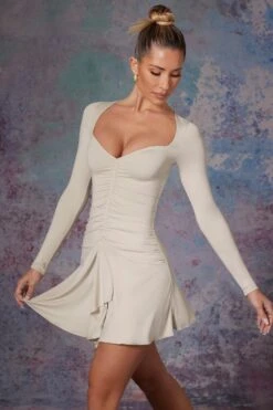 Long Sleeve Waterfall Skirt Mini Dress In Stone -Women Clothes Shop 5473 8 Lili Stone Long Sleeve Halter Neck Mini Dress With Waterfall Skirt